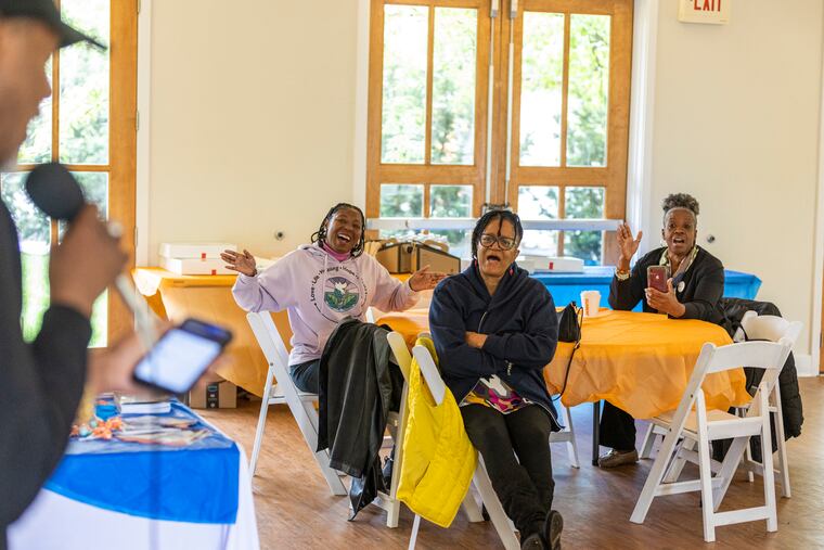 Will Harris, of North Philadelphia, leads the audience in singing 'I Need You to Survive' during a vigil and healing event Saturday at Franklin Square Park in Center City. The event marked the annual national Crime Victims' Rights Week observance.