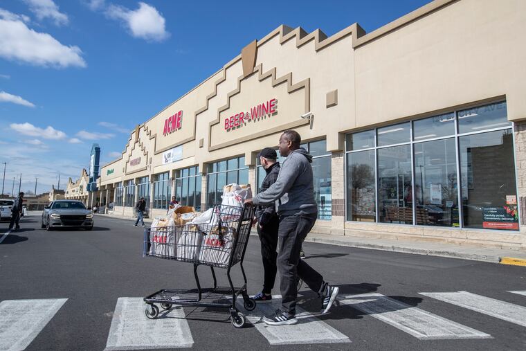 Customers leave the Acme Market in the Bala Cynwyd Shopping Center on City Line Avenue in Montgomery County on Sunday March 15, 2020.
