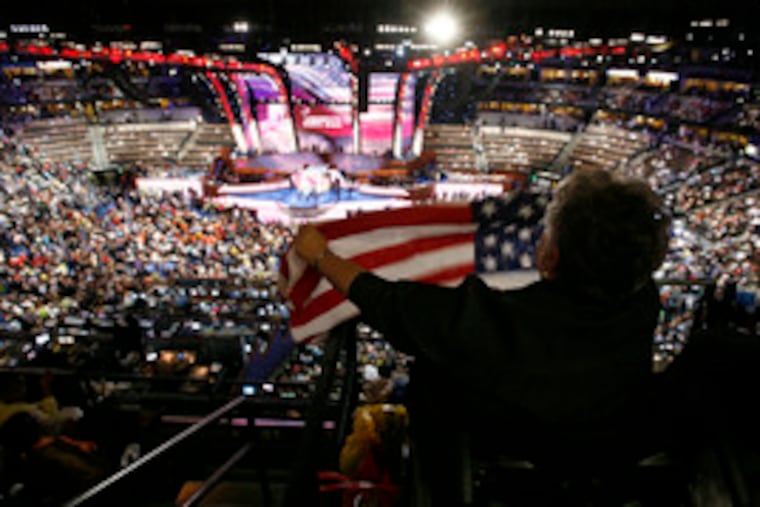 From a bird's-eye view, Mississippi delegate Mary Troupe, executive director of the Coalition for Citizens With Disabilities, waves a flag during the convention.