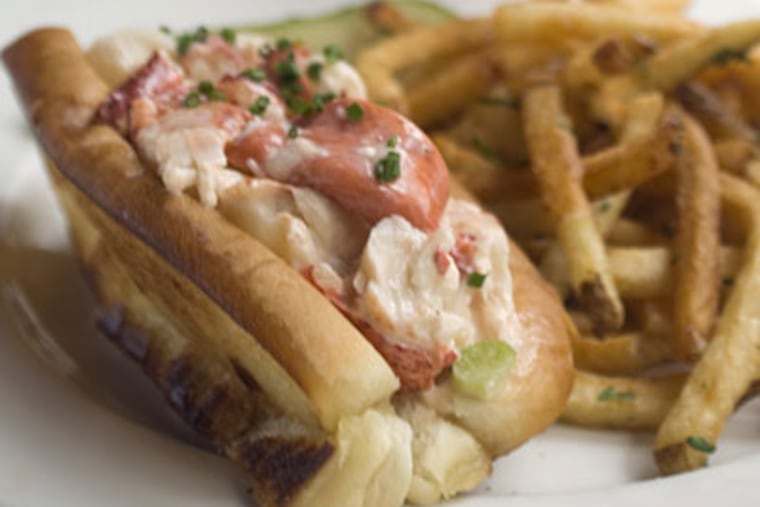 Trial and error did the trick at Oyster House, where a heap of lobster on a toasted Maine bun goes for $26 (with fries at dinner). (RON TARVER / Staff Photographer)