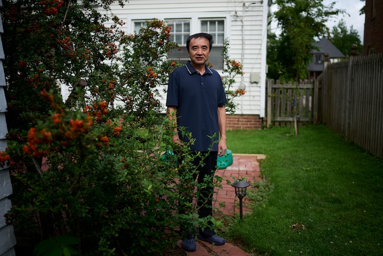 Qing Wang, who was accused of hiding ties to a Chinese university while securing U.S. research grants, says he "was shocked" when he was arrested in May 2020. Justice officials dismissed charges this month. Wang is photographed at home in Cleveland on Aug. 18, 2021. Photo for The Washington Post by Dustin Franz