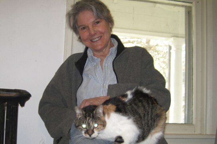 Kate Decker, with her cat.