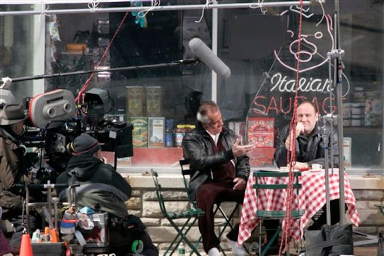 FILE - Actors Tony Sirico, left, who plays Paulie Walnuts and James Gandolfini, right, who plays Tony Soprano, shoot a scene from the mafia drama, "The Sopranos," outside the fictional Satriale's pork store in Kearny, N.J., in this Wednesday, March 21, 2007 file photo. (Editor's note: A different photo ran with this story when it was originally published on June 11, 2007.)