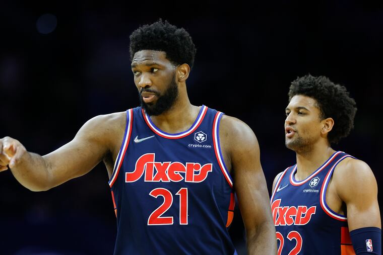 Sixers center Joel Embiid and guard Matisse Thybulle against the Dallas Mavericks on Friday, March 18, 2022 in Philadelphia.