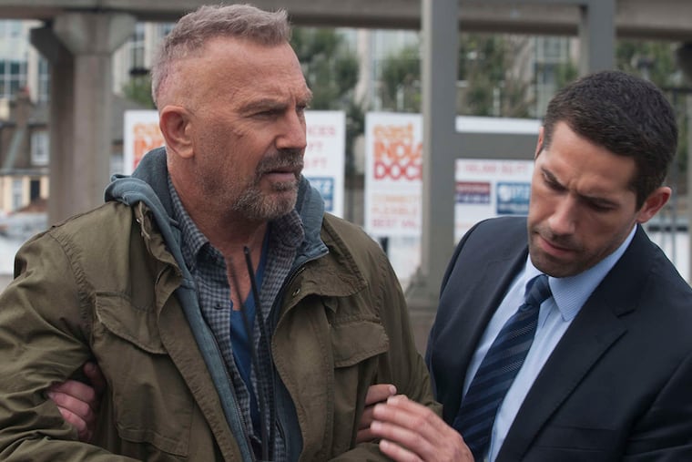 Kevin Costner (left, with Scott Adkins) is a sociopath who undergoes a memory swap in the espionage thriller "Criminal."