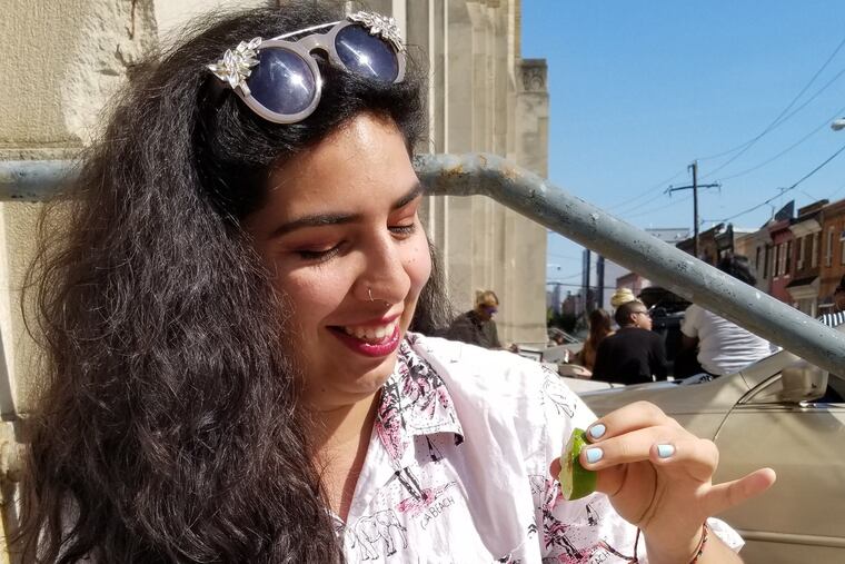 Alicia Frausto, organizer of the Philly chapter of Veggie Mijas, enjoys a Sweet Green vegan salad in South Philly.