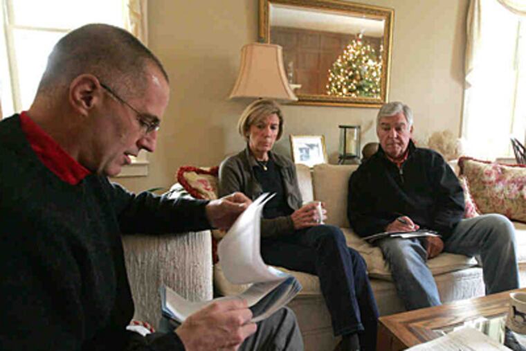 Karl Ahlswede, who quit his surgery practice, discusses living wills with Judy and Jim Snyder at their Lower Gwynedd home. (DAVID SWANSON / Staff Photographer)