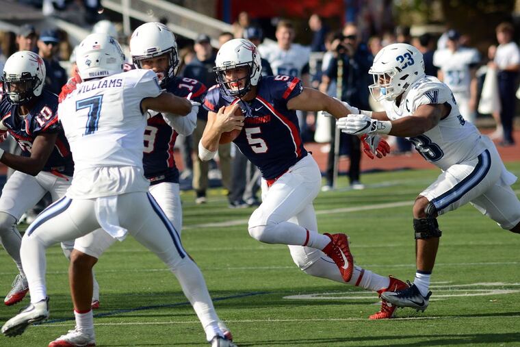 Richmond quarterback Kyle Lauletta (5) runs with the football as Villanova's Ed Shockley (33) chases in the second quarter Saturday, November 04, 2017 at Villanova Stadium in Villanova, Pennsylvania.