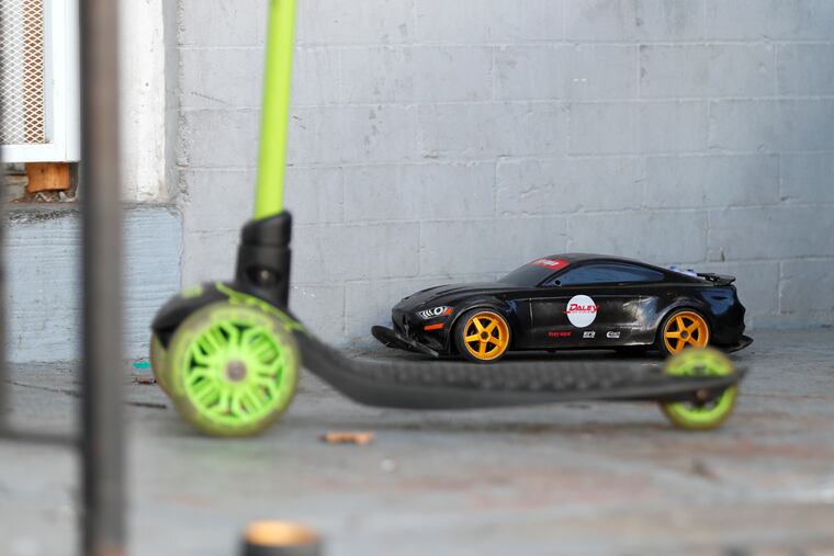 The front of a house on the 200 block of N. Simpson St. where Zamar Jones, 7, was playing on his porch when he was struck in the head by gunfire. According to a neighbor, the toy car and scooter still sitting on the porch were Zamar’s toys.