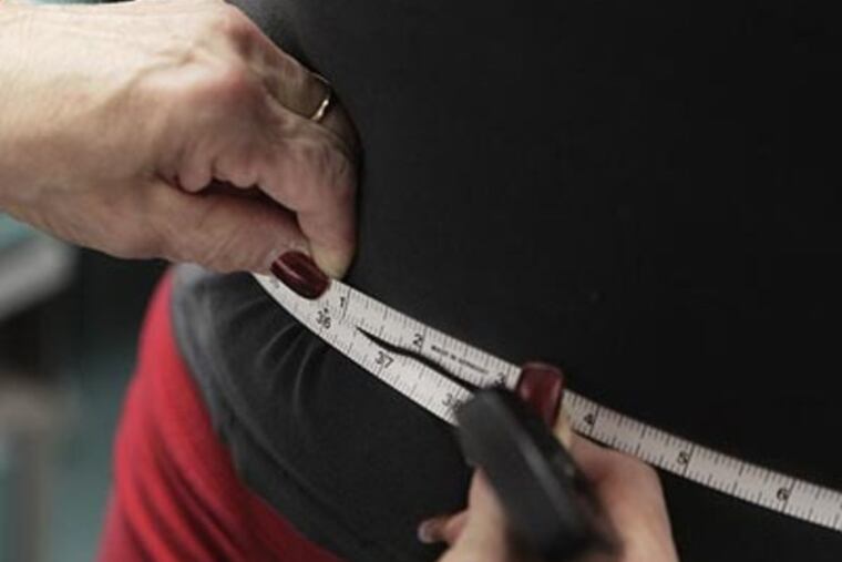 Researchers looked for links between changes in long-term weight and changes in eating habits, namely frequency of consuming fried foods, fish, fruits and vegetables, restaurant meals, and meat and cheese. (AP Photo/M. Spencer Green)