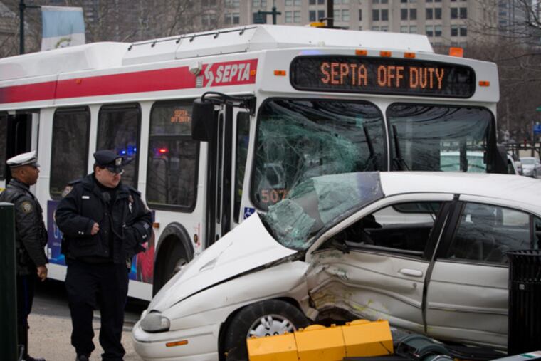 Philadelphia and SEPTA police at the scene of an accident today, April 7, 2014, involving a bus and car at N. 22nd and Ben Franklin Parkway. ( ALEJANDRO A. ALVAREZ / STAFF PHOTOGRAPHER )