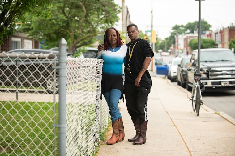 Strawberry Mansion residents Evine Hanberry and Boaz Hamm pose for a portrait outside of Garden of Prayer Church on June 9. The couple attended a meeting hosted by the church to discuss potential SEPTA budget cuts that will affect the neighborhood.