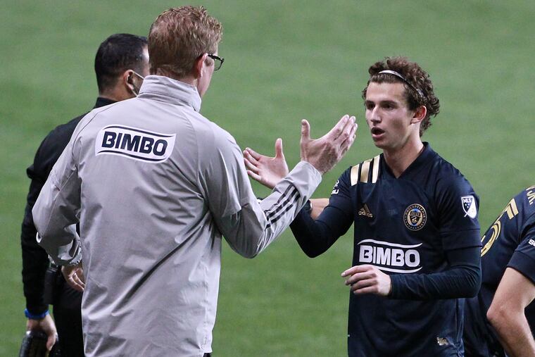 Union midfielder Brenden Aaronson, right, and manager Jim Curtin, left, are close to bringing the team its first ever trophy.
