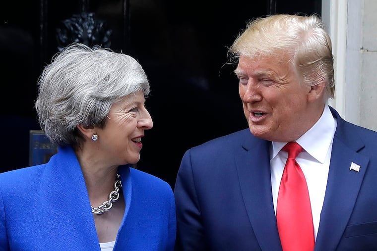 Britain's Prime Minister Theresa May (left) greets President Donald Trump outside 10 Downing Street in central London on Tuesday.