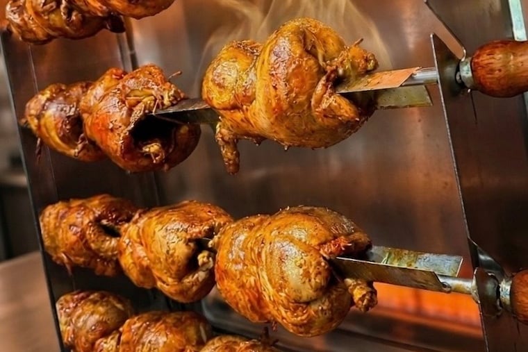 Chiapas-style chickens roast on the spit at Pollos Asados PLV in Pleasantville.