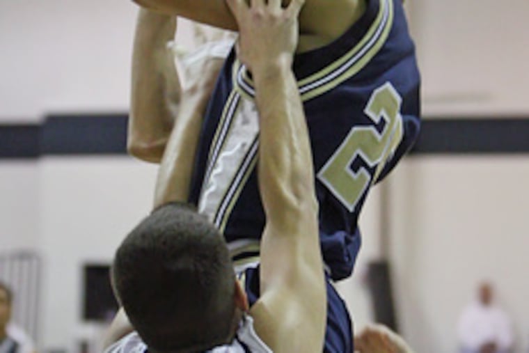 Holy Spirit's Preston Smith drives to the basket against Shawnee. He's one of three returning senior starters for the team.