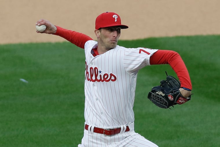 The Phillies' Connor Brogdon delivers a pitch in the 10th inning against the Atlanta Braves in Thursday's season opener.