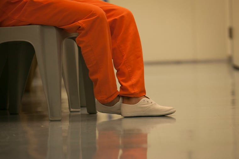 A patient at Philadelphia's Riverside Correctional Facility waits to receive an opioid treatment medication in 2018, shortly after the city launched a program to treat addicted people in its jail system. Addiction treatment at county jails around the state varies widely, a new report has found.