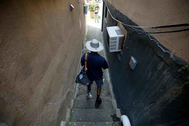 A mail carrier delivers mail in Upper Darby.