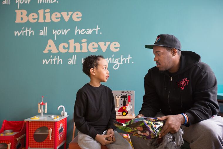 Cancer patient Zahir Berry, 7, meets Al Harris, who founded "Cancer Who?" as an organization to support those like Zahir who are dealing with cancer and its treatments. Some are children, some are adults.