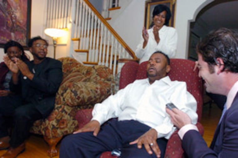 Democrat Curtis Jones Jr. at home May 15, wife Jazelle behind him, after winning the City Council 4th District primary.