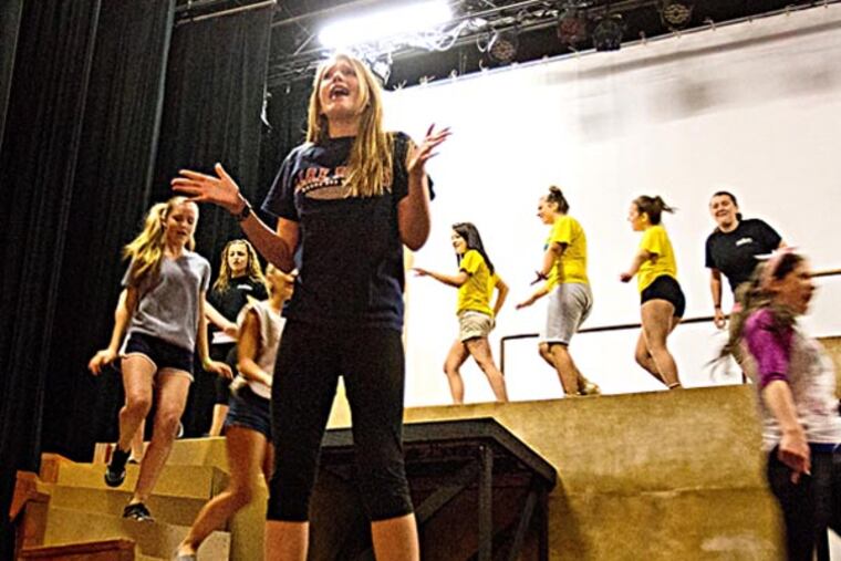 Amanda Peacock, 14, of Williamstown (foreground) will understudy the lead roll of Elle Woods. Here she rehearses the song ‘So Much Better’ from Legally Blonde during Summer Theater Camp at the Grand Theater, Williamstown, July 23, 2013. ( DAVID M WARREN / Staff Photographer )
