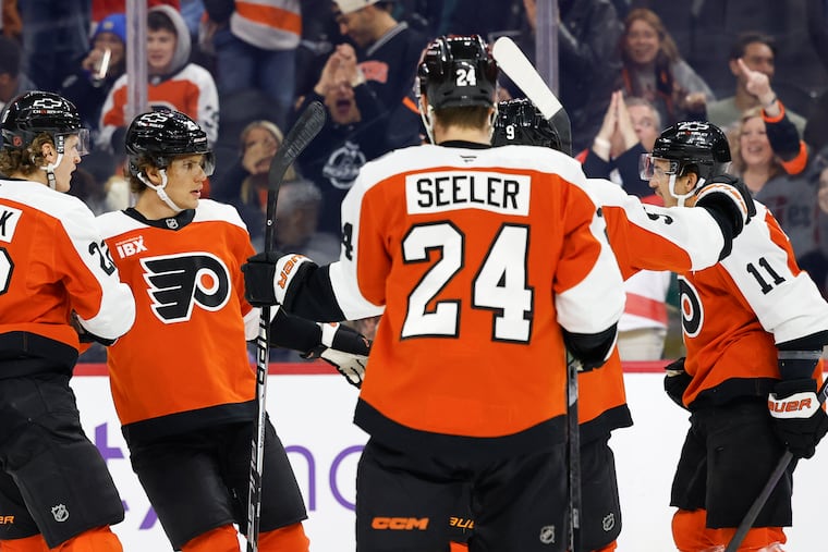 Flyers center Christian Dvorak (left) celebrates his first period goal against the Toronto Maple Leafs on Saturday.