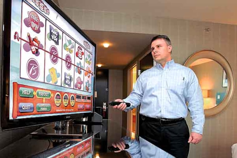 Borgata Hotel Casino in Atlantic City will be offering DigiCasino, the first in-room gaming offered in the United States. John Forelli, Vice President of Information Technology at Borgata demonstrates a slot machine game. ( CHARLES FOX / Staff Photographer )