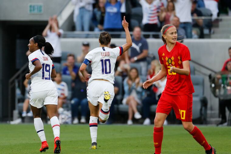 Carli Lloyd celebrates after scoring one of her two goals in the U.S. women's soccer team's 6-0 win over Belgium.
