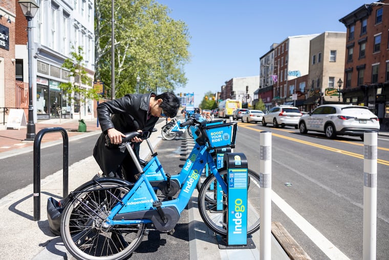 Ellen Yin docks an Indigo bike in Old City. The restauranteur rides most days, so long as the weather is warm enough.