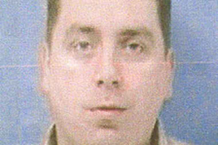 John McLaughlin was apprehended today in connection with a slaying at his Port Richmond bar.