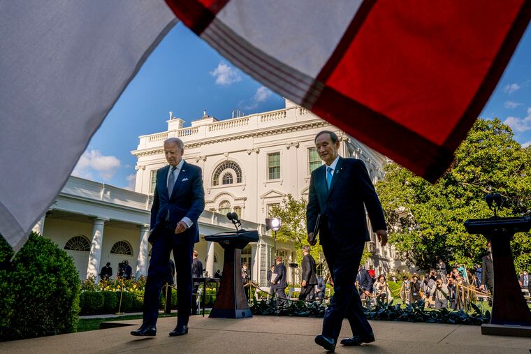 President Joe Biden and Japanese Prime Minister Yoshihide Suga leave a news conference in the Rose Garden of the White House in Washington, Friday, April 16, 2021.