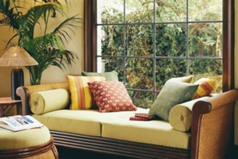 A colonial-style daybed crafted from plantation-grown hardwood, with bolster pillows and a twin mattress, $2,640.