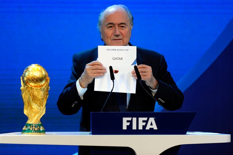 Then-FIFA President Sepp Blatter announces in December 2010 that Qatar will host the 2022 World Cup.