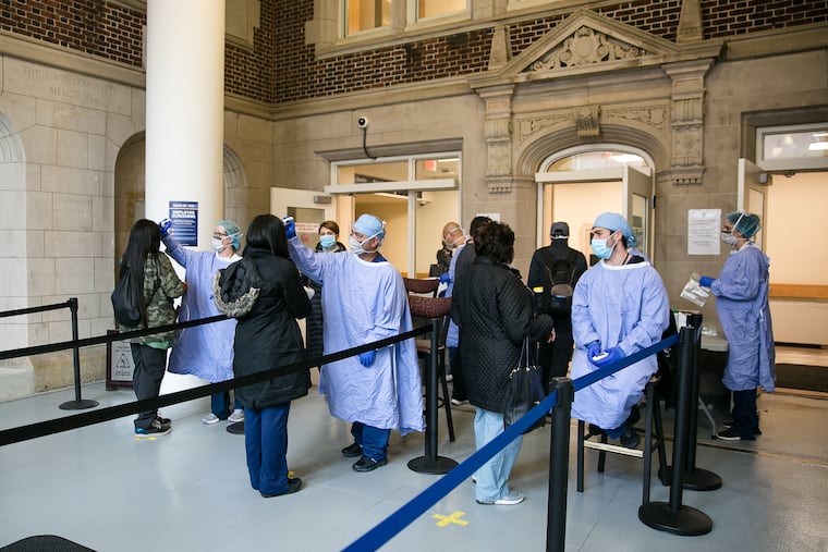 Employees are being temperature scanned as they enter the Hospital of the University of Pennsylvania. Penn has fast-tracked programs aimed at keeping pregnant women out of the hospital as much as possible as the coronavirus spreads.
