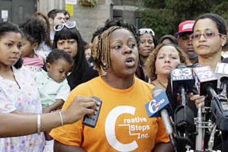 Alethea Wright, Creative Steps director, speaks to the media after meeting with parents yesterday. (YONG KIM / Staff photographer)