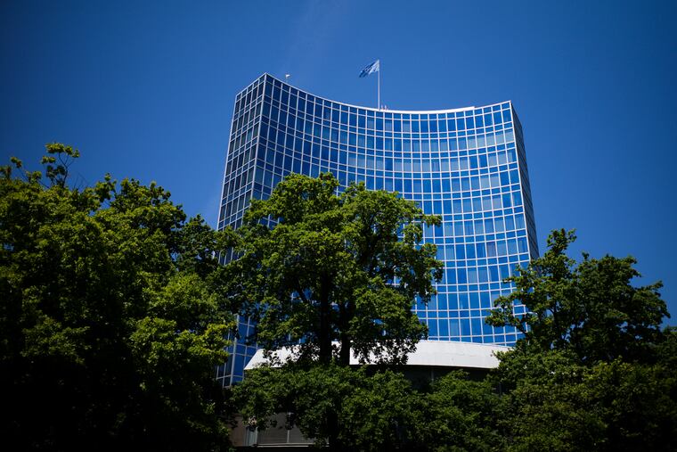 The United Nations flag waves in the wind on the top of an U.N. building in Geneva, Switzerland.