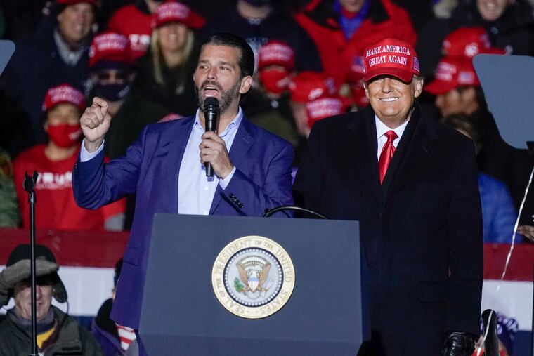 President Donald Trump watches as Donald Trump Jr. speaks at a campaign event No. 2 in Kenosha, Wis.