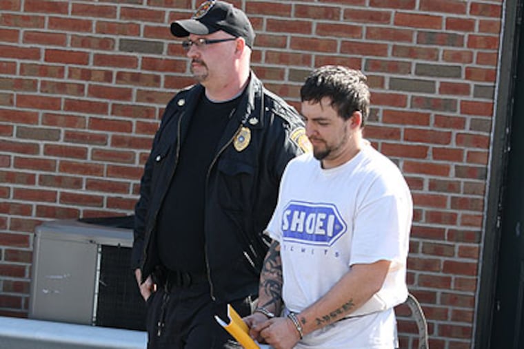 Walter Meyerle being led away after his arraignment Thursday in district court in Bristol Borough. (Larry King / Staff)