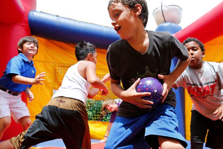 Xavier Delgado played with his friends in a bounce room at his 10th birthday party on Aug. 4. At left, a rescuer pulled an injured Xavier from the Plaza Towers rubble.