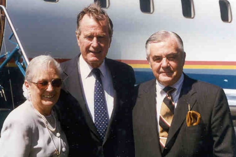 Mr. Whiteside (right) and his wife, Eileen, met President George H.W. Bush at an event at Rochester Institute of Technology.