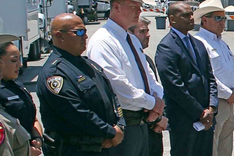 Uvalde School Police Chief Pete Arredondo, second from left, outside of the Robb Elementary school in Uvalde, Texas, on May 26.