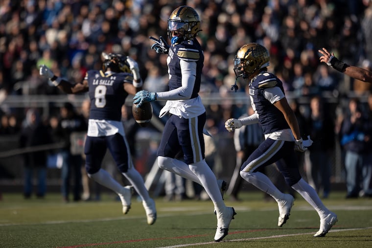 The Explorers' Trey Hopkins (3) celebrates after his interception during a PIAA Class 6A semifinal against North Penn on Nov. 29.