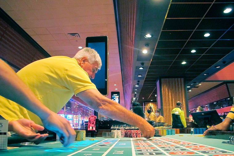 Gamblers placing a bet on a roulette table at Bally's casino in Atlantic City, N.J. A bill granting tax relief to Atlantic City's nine casinos is in the hands of New Jersey Gov. Phil Murphy on Dec. 21, 2021 following its passage by the state Legislature.
