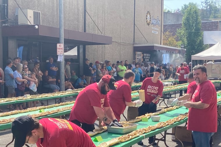 Main Street Grill in Lewiston, Idaho, making a 700-foot-long cheesesteak on Aug. 26. It now holds the unofficial world record for longest cheesesteak.
