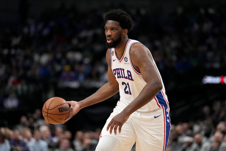 Philadelphia 76ers center Joel Embiid (21) makes a pass as he works against the Dallas Mavericks.