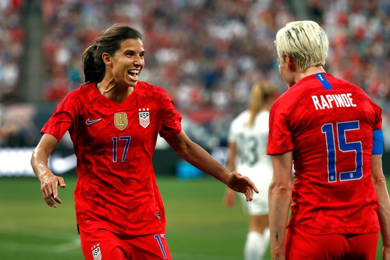 Tobin Heath (left) celebrates with Megan Rapinoe after scoring the United States' first goal against New Zealand. Rapinoe had the assist.