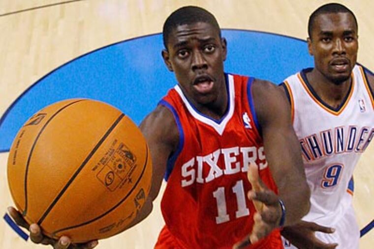 Jrue Holiday and the Sixers don't seem to miss injured star Andre Iguodala. (Sue Ogrocki/AP)