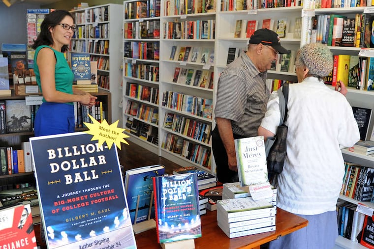 Julie Beddingfield (left) talks with customers Sam and Teresa Semola at Inkwood Books in Haddonfield, which will host authors and children's events.