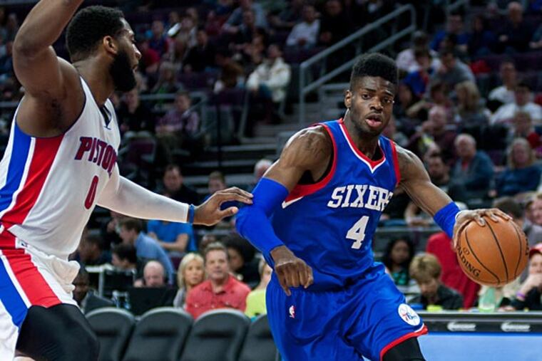 Philadelphia 76ers center Nerlens Noel (4) drives to the basket during the third quarter against Detroit Pistons center Andre Drummond (0) at The Palace of Auburn Hills. Detroit won 107-89. (Tim Fuller/USA Today)